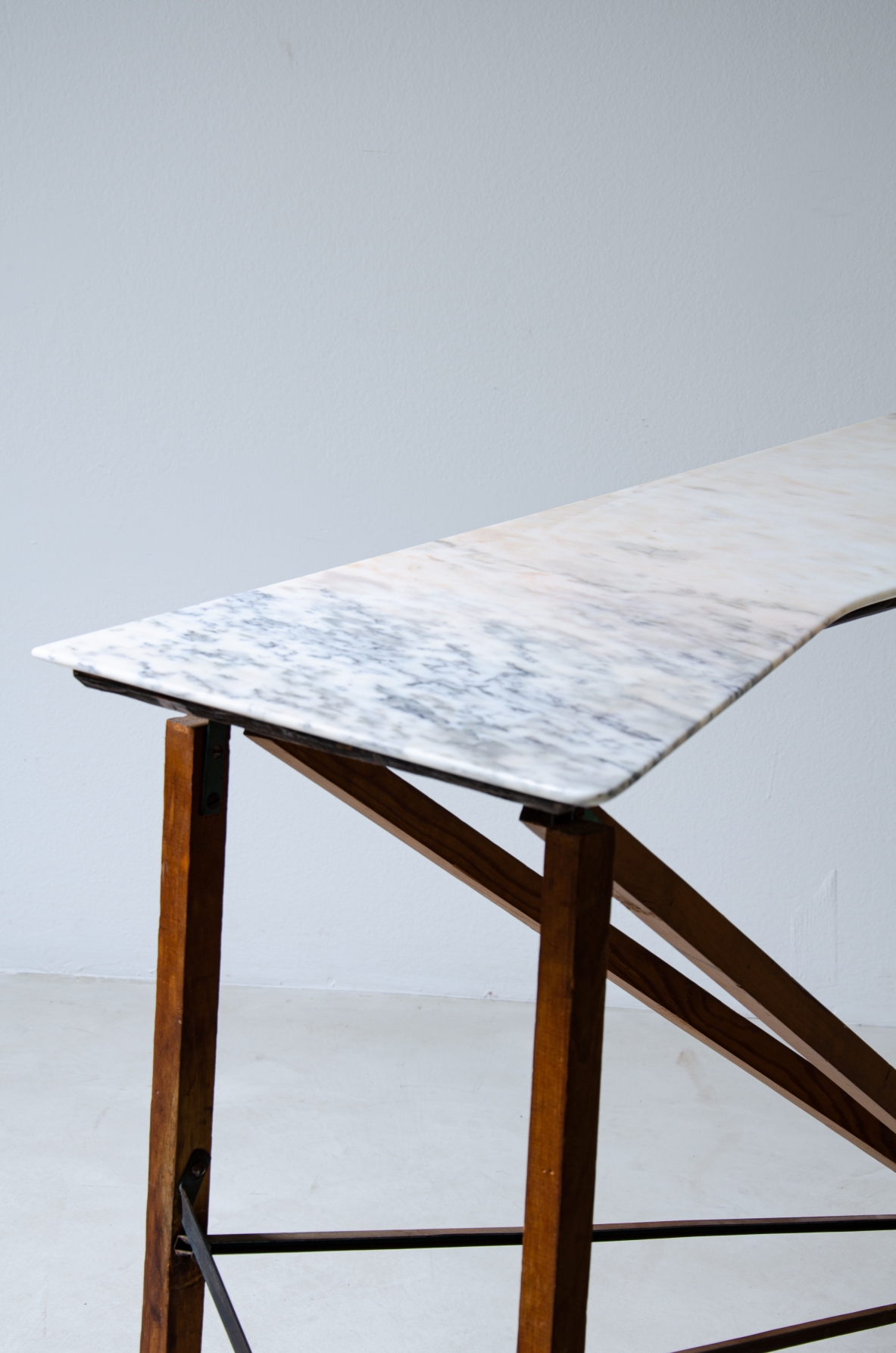 Console table with wooden structure, metal supports and irregular-shaped marble top. Italian manufacture, 1950's.