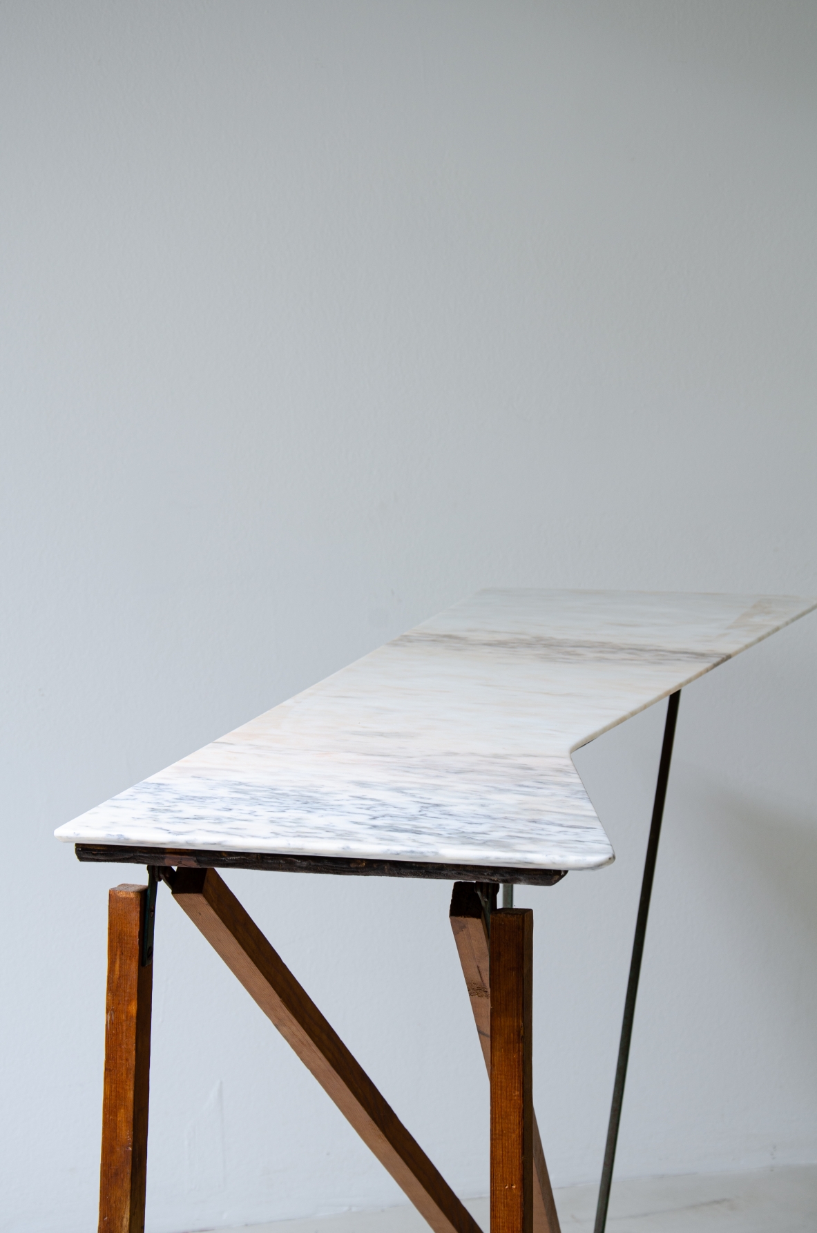 Console table with wooden structure, metal supports and irregular-shaped marble top. Italian manufacture, 1950's.