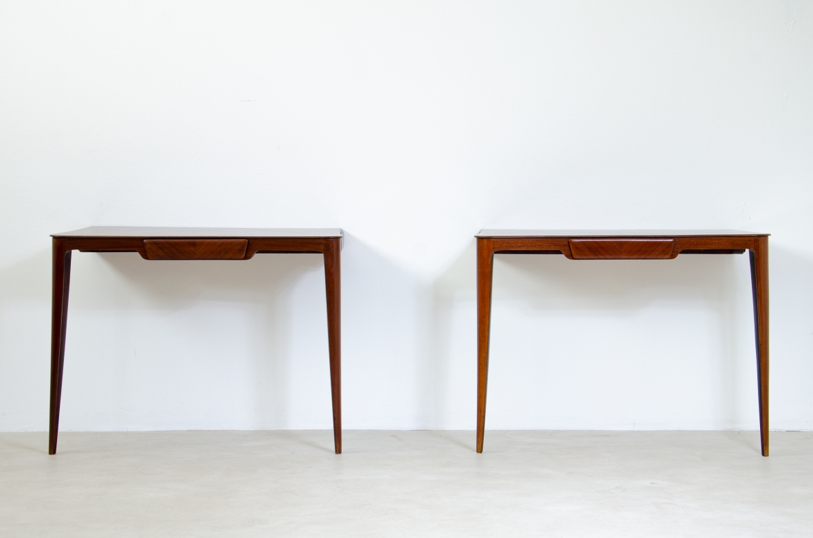 Elegant pair of wooden consoles with exotic wood veneer top and shaped drawer on the front.  Attr. Carlo Rava, 1950s.