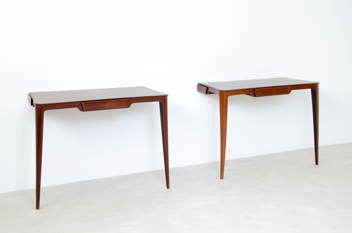 Elegant pair of wooden consoles with exotic wood veneer top and shaped drawer on the front.  Attr. Carlo Rava, 1950s.