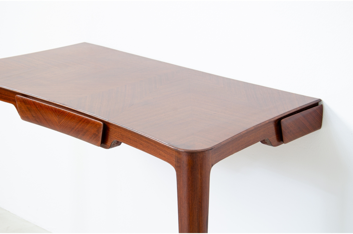 Elegant pair of wooden consoles with exotic wood veneer top and shaped drawer on the front.  Attr. Carlo Rava, 1950s.
