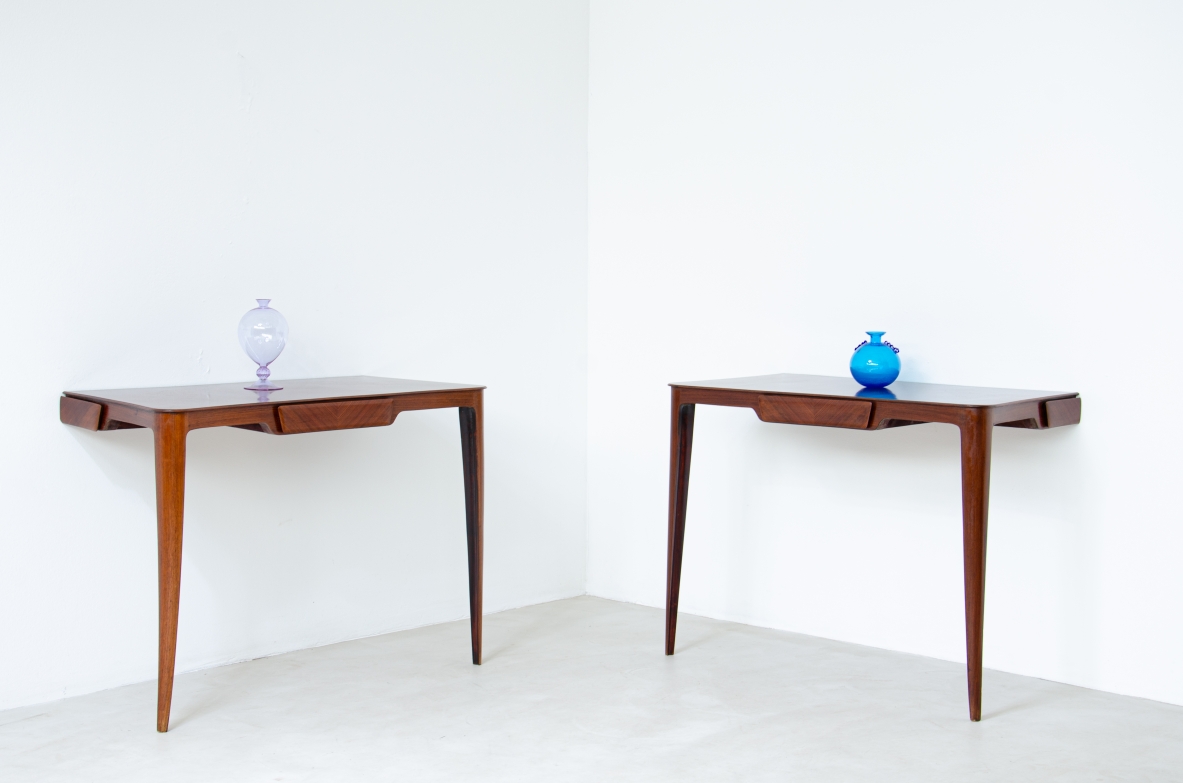 Elegant pair of wooden consoles with exotic wood veneer top and shaped drawer on the front.  Attr. Carlo Rava, 1950s.