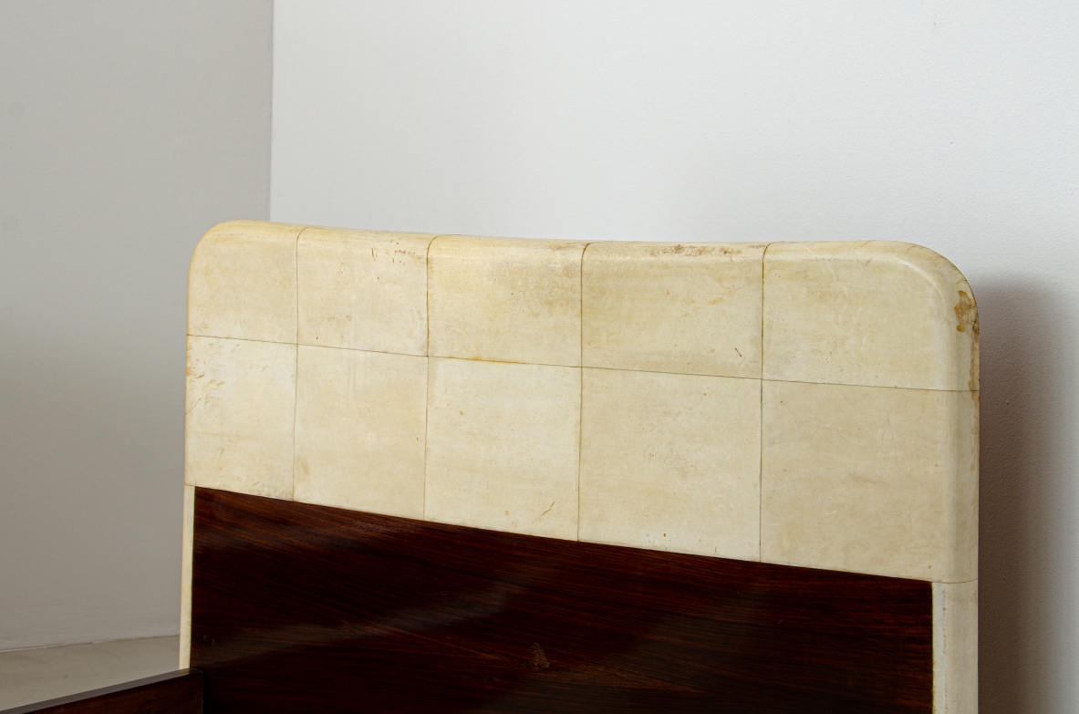 Pair of elegant rosewood beds with blond maple profiles and parchment headboard, brass details.  Italian manufacture, 1940's.