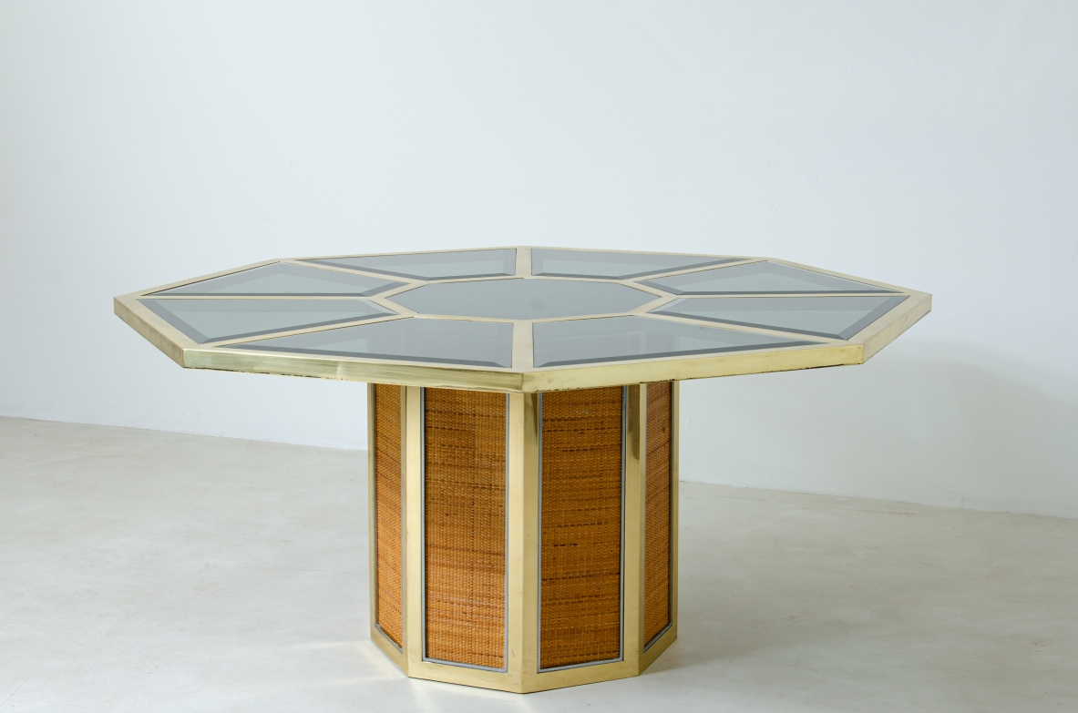 Romeo Rega. Octagonal table in brass, glass and straw. Manufacture Sabot, Italy, 1970's