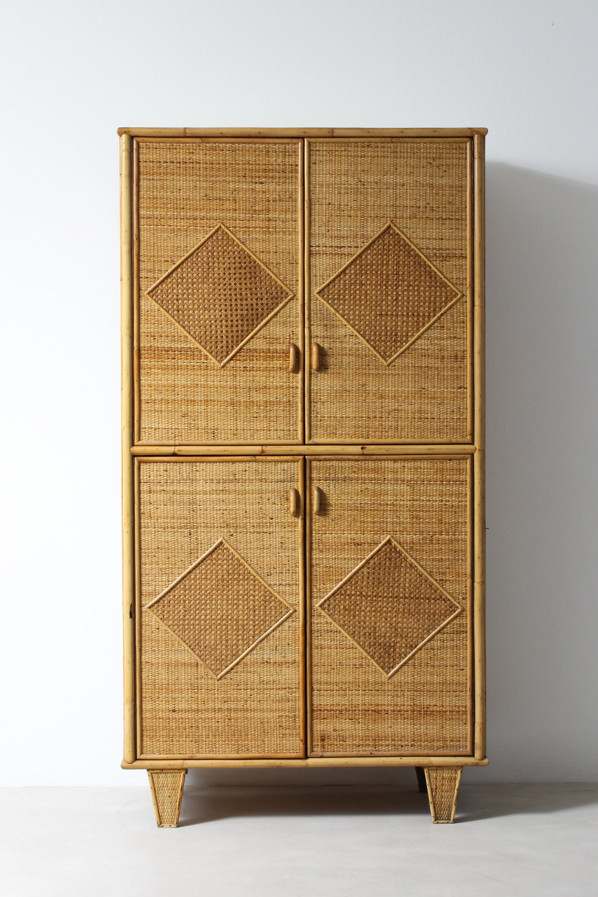 Wardrobe in ash wood, covering in raffia and rattan. Vivai del Sud, 1960's.