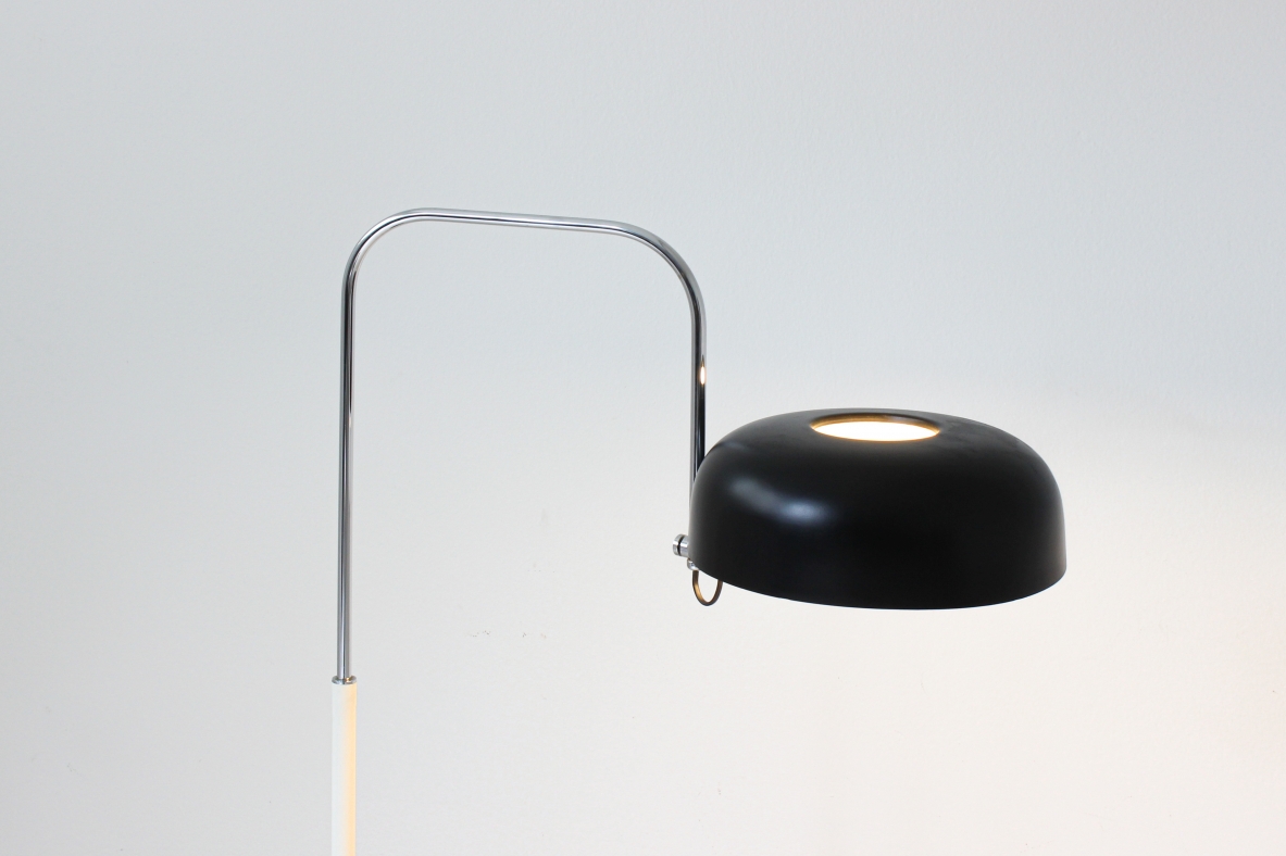 Reading lamp in black and white lacquered metal with curved chromed metal stem.