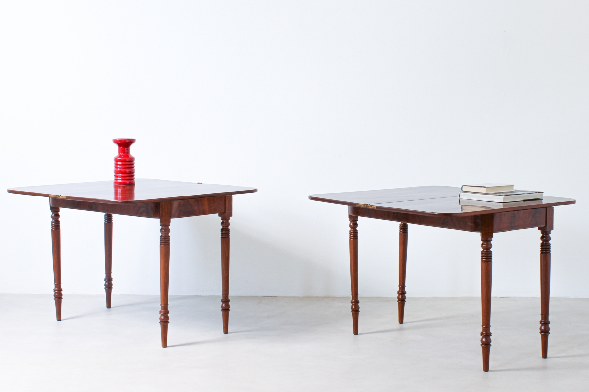 Pair of elegant consoles in mahogany with double book top and turned legs.