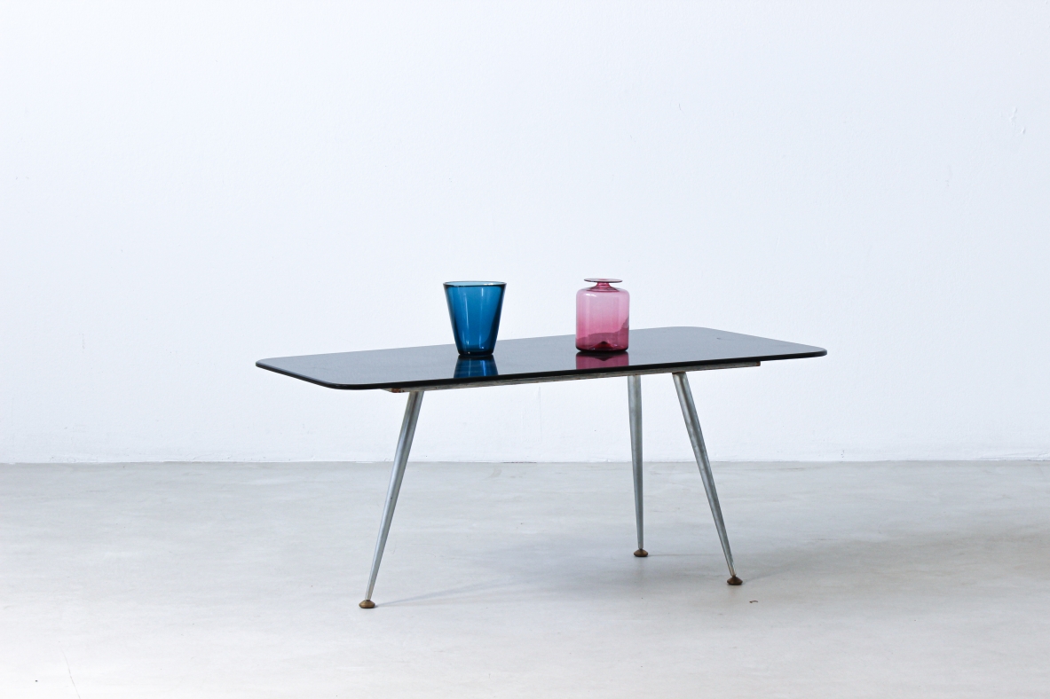 Coffee table with opaline glass top and aluminum legs with brass ends.