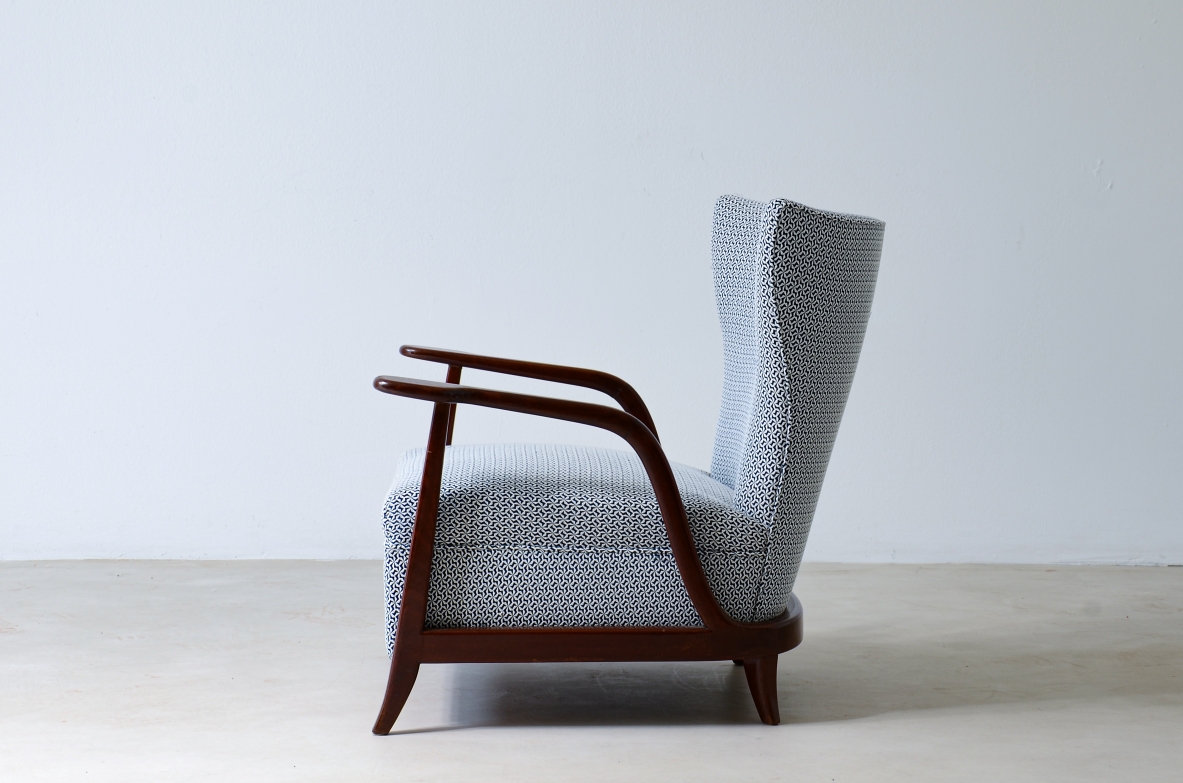 Enrico Ciuti (1910 - 1991)  Elegant armchair in curved wood and upholstered fabric  Italian manufacture, around 1940.