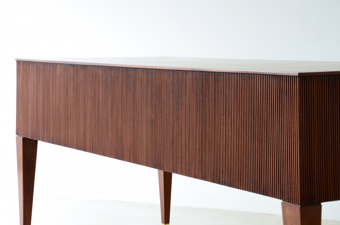 Mahogany desk with 4 drawers, front and sides in grissinato wood, legs with elegant brass tips.  1950s Italian manufacture.