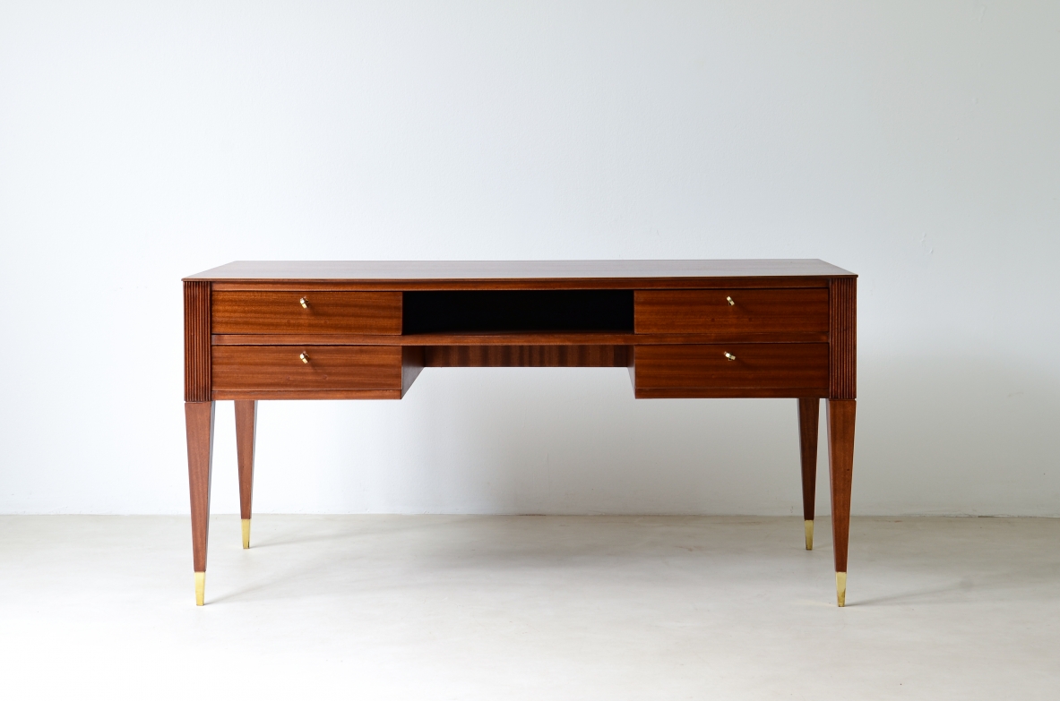 Mahogany desk with 4 drawers, front and sides in grissinato wood, legs with elegant brass tips.  1950s Italian manufacture.