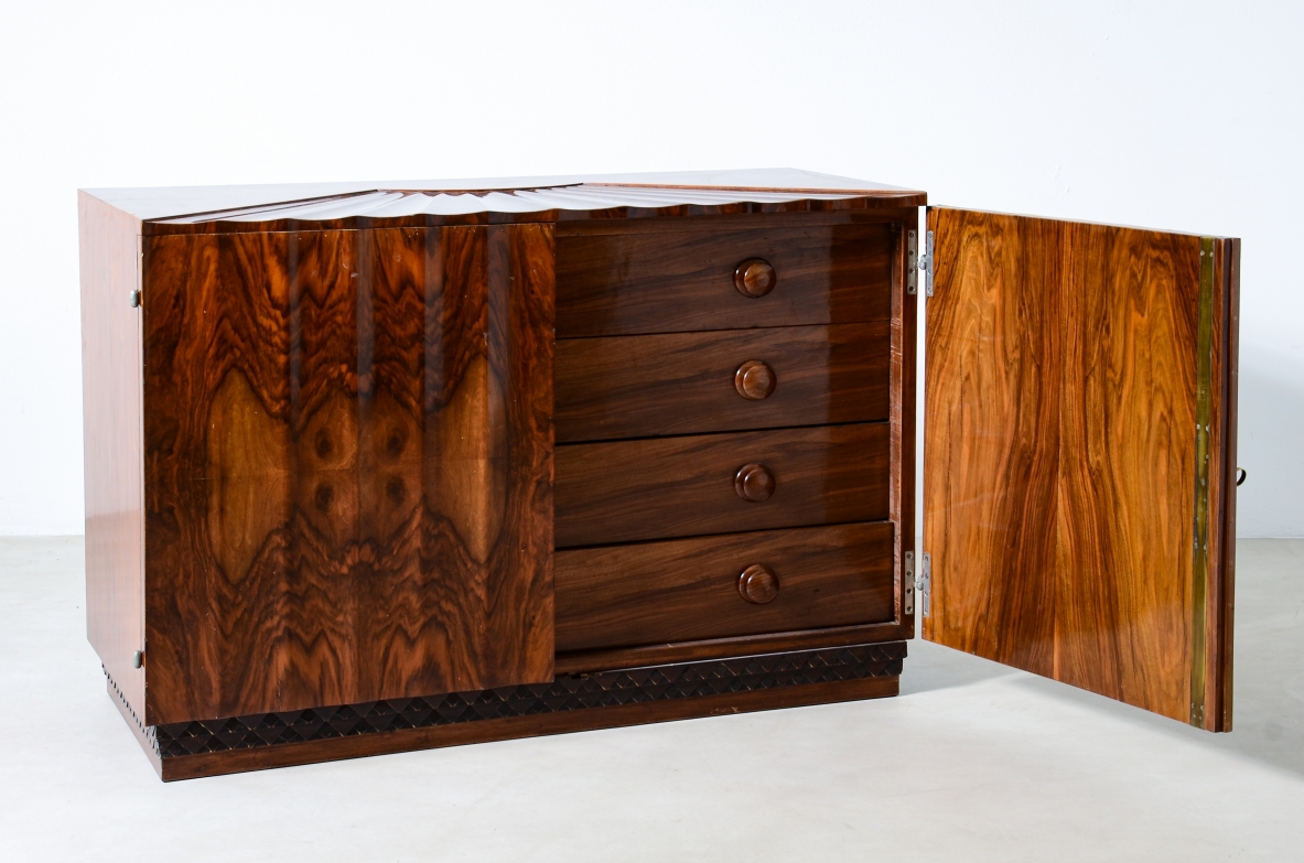 Borsani Varedo  Unique chest of drawers made of a very high quality with 4 drawers hidden by two doors with grooves that continue on the top forming a shell design.  Walnut and walnut briar, metal and brass details.