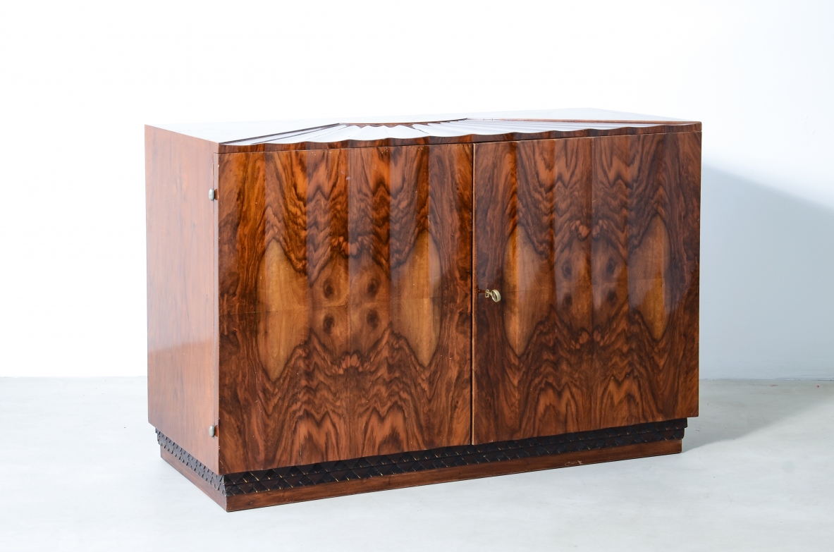 Borsani Varedo  Unique chest of drawers made of a very high quality with 4 drawers hidden by two doors with grooves that continue on the top forming a shell design.  Walnut and walnut briar, metal and brass details.