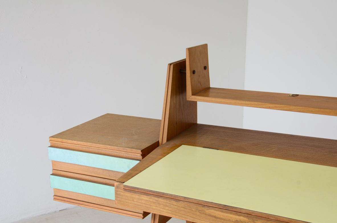Ico Parisi (1916-1996)  Bedroom writing desk in oak with compartment for objects and shelf. Two drawers on the right side. Top and drawers with original period polypropyleneapplications.