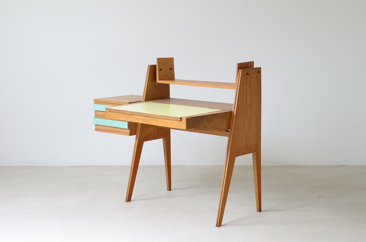 Ico Parisi (1916-1996)  Bedroom writing desk in oak with compartment for objects and shelf. Two drawers on the right side. Top and drawers with original period polypropyleneapplications.
