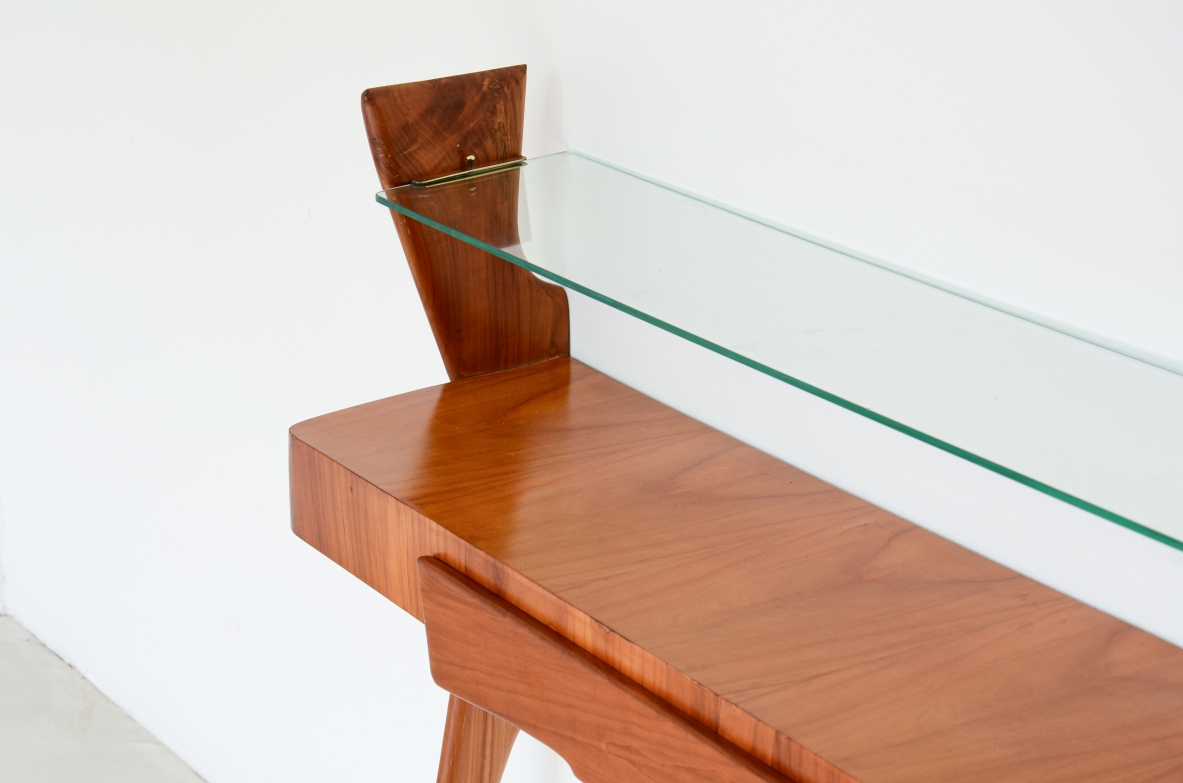Console table in cherry wood with thin long  legs, one drawer and glass shelf.  1950's