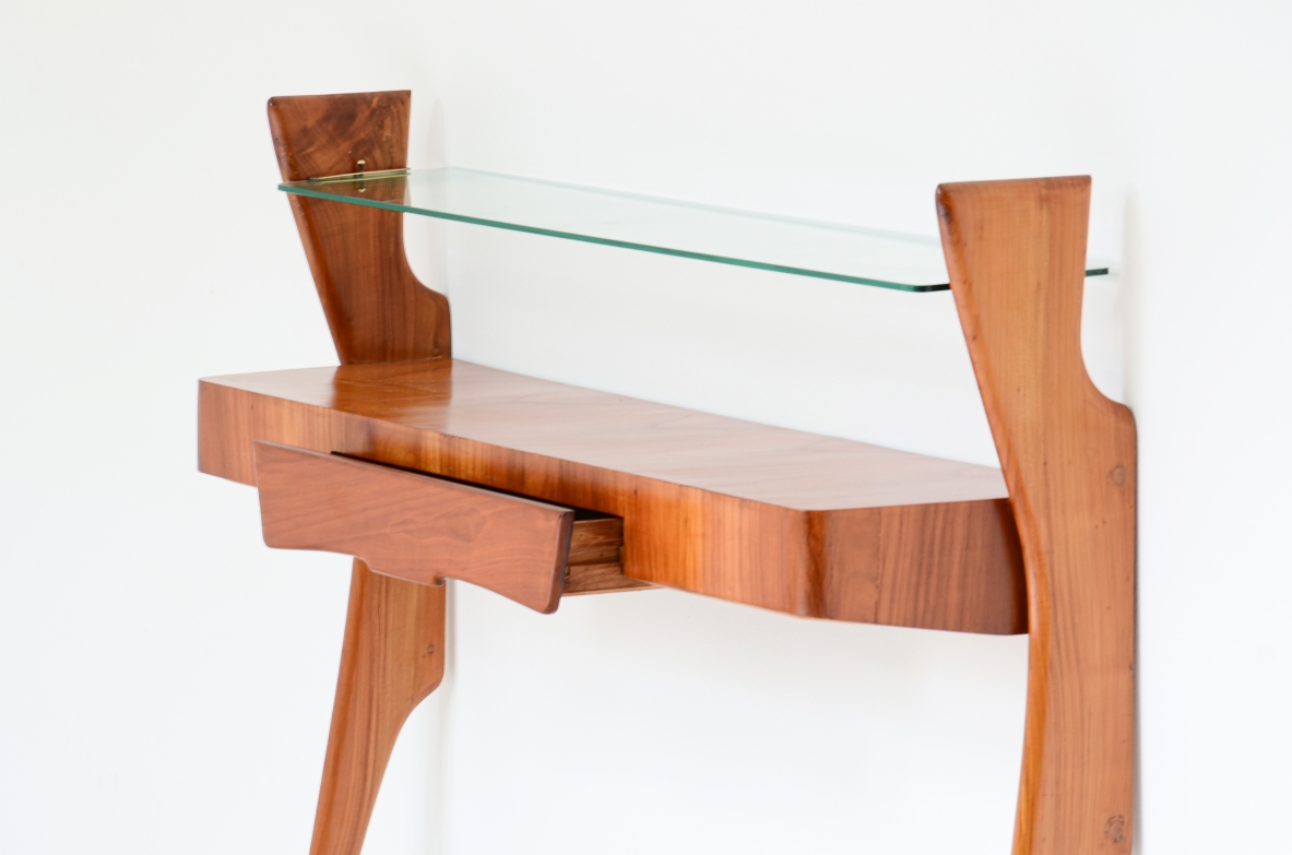 Console table in cherry wood with thin long  legs, one drawer and glass shelf.  1950's