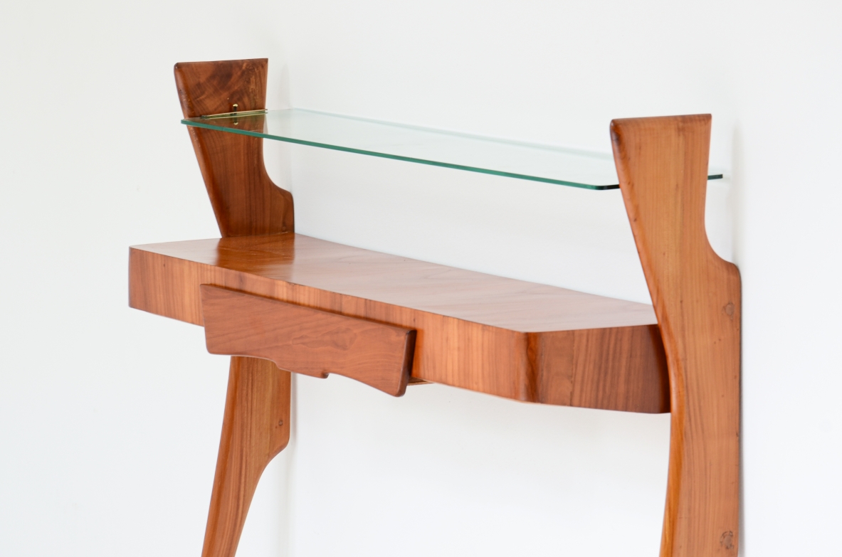 Console table in cherry wood with thin long  legs, one drawer and glass shelf.  1950's