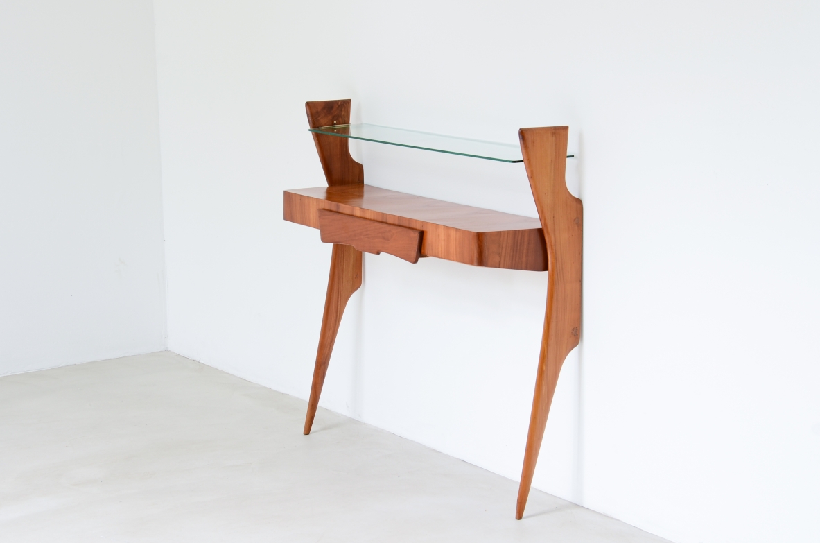 Console table in cherry wood with thin long  legs, one drawer and glass shelf.  1950's