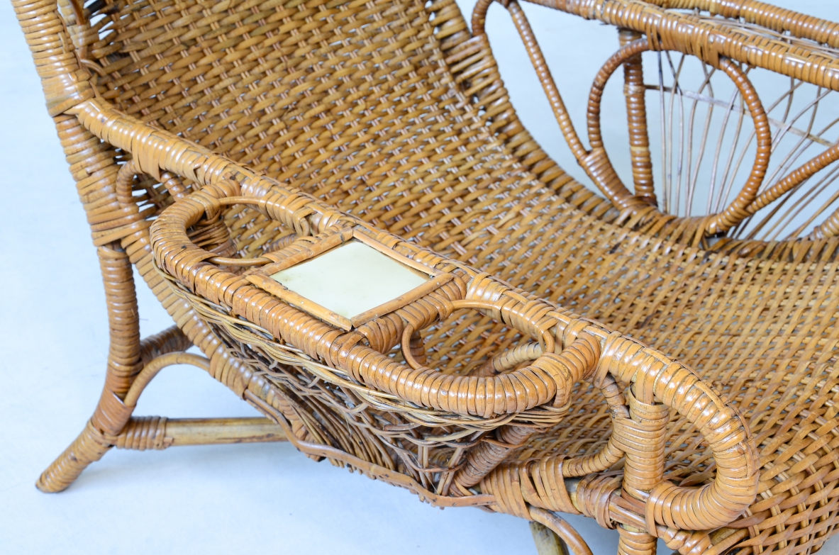 Pair of elegant willow armchairs with weaving on the seat and back as well as composed details, shapes and decorations. Italian manufacture 1950ca.