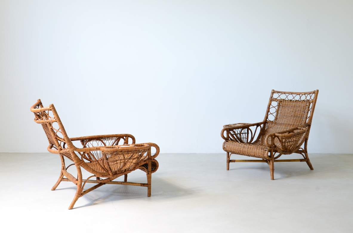 Pair of elegant willow armchairs with weaving on the seat and back as well as composed details, shapes and decorations. Italian manufacture 1950ca.