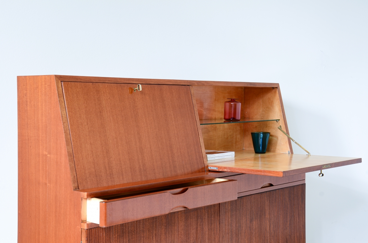 Storage unit with front in grinded wood and two drop-down shelves with interiors in blond maple and a ground glass top.  Two drawers and elegant feet with brass tips.  Italian manufacture, 1940's
