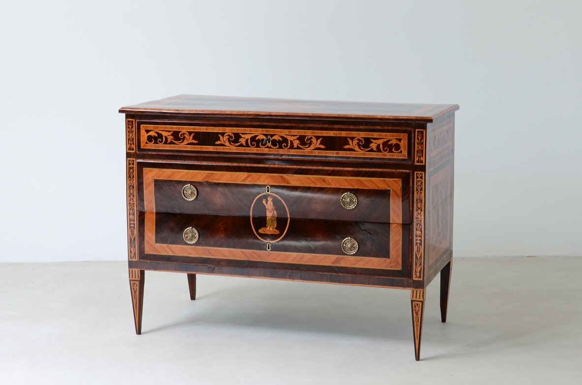 Furniture inlaid with precious woods. Three drawers with brass handles and vents.  Italian manufacture, Lombardy, Louis XVI era, around 1780