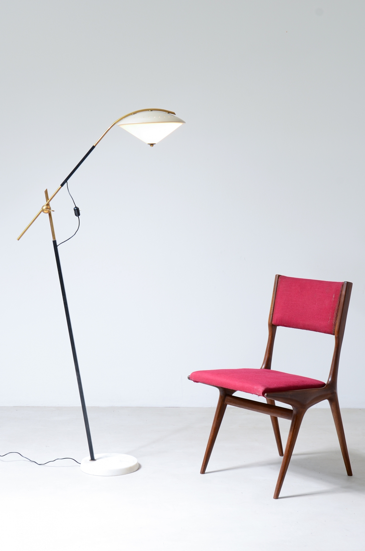 Angelo Ostuni  Elegant floor lamp with adjustable arm, metal and glass hat and diamond cut marble base.  Oluce Milano, Italian manufacture 1950's.