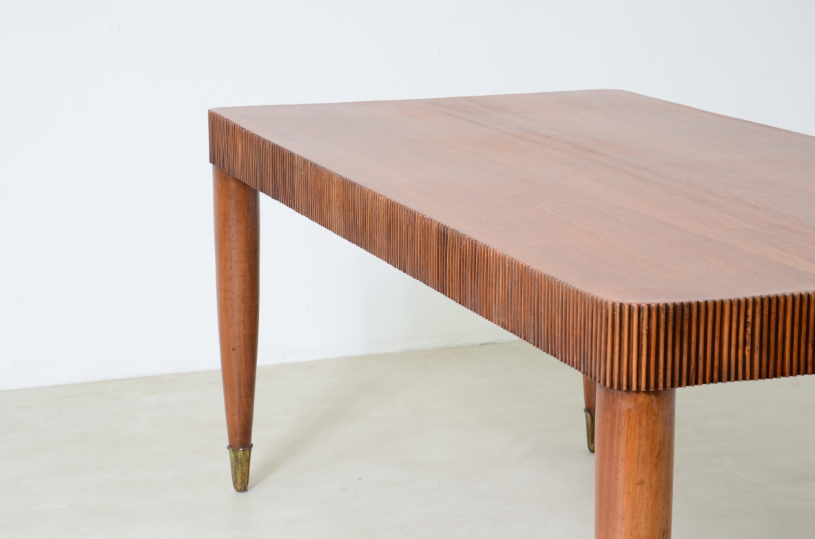 Elegant table with band motif in grissinato wood, top in walnut wood, turned legs with carved wooden tips.  Italian manufacture approx. 1940's.
