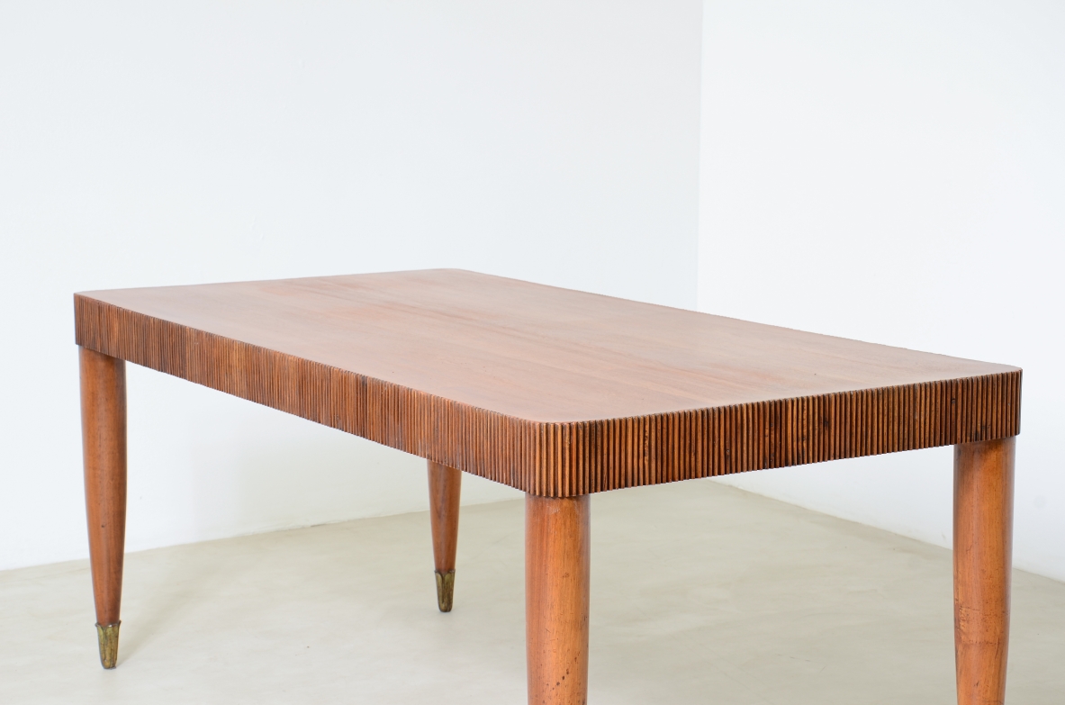 Elegant table with band motif in grissinato wood, top in walnut wood, turned legs with carved wooden tips.  Italian manufacture approx. 1940's.