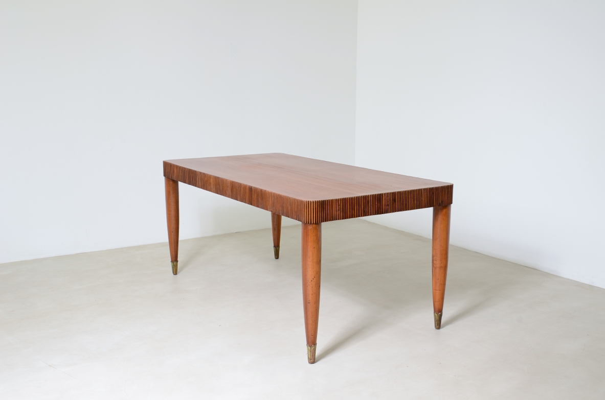 Elegant table with band motif in grissinato wood, top in walnut wood, turned legs with carved wooden tips.  Italian manufacture approx. 1940's.