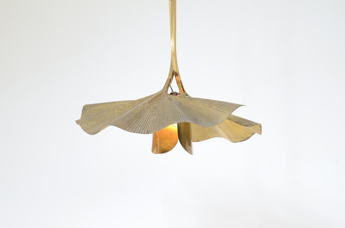 Tommaso Barbi  Large pendant chandelier made by the renowned artist and designer in the shape of a flower composed of 2 large brass ginko leaves and intertwined branches.  Italian manufacture from the 70's