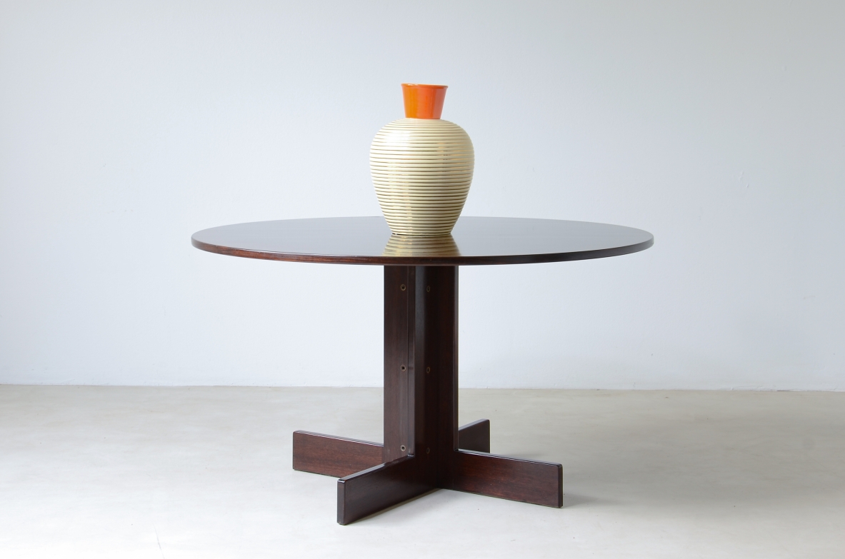 Rosewood table with helix base, brass details.  Italian manufacture, 1970's.