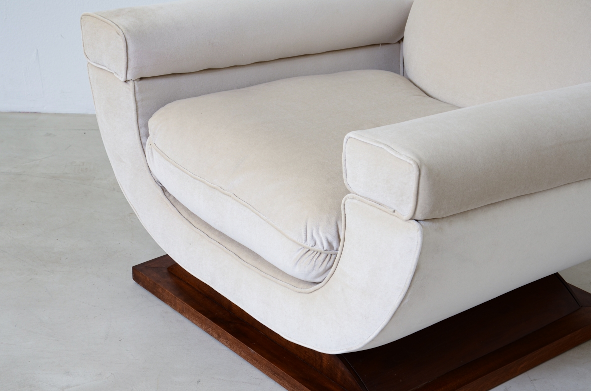 Pair of large organically shaped armchairs with wooden base, covered in cotton velvet.  Italian manufacture from the 1960s