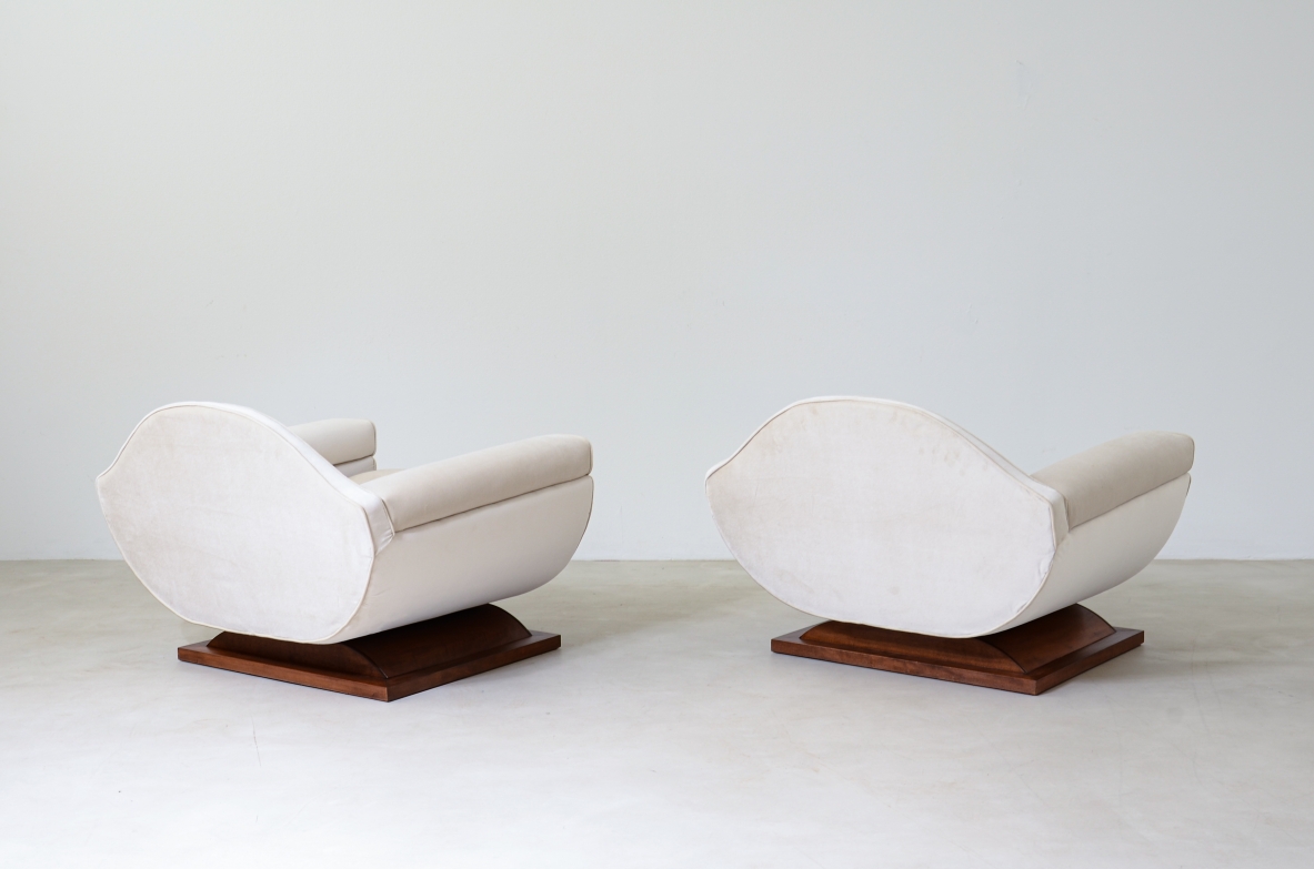 Pair of large organically shaped armchairs with wooden base, covered in cotton velvet.  Italian manufacture from the 1960s