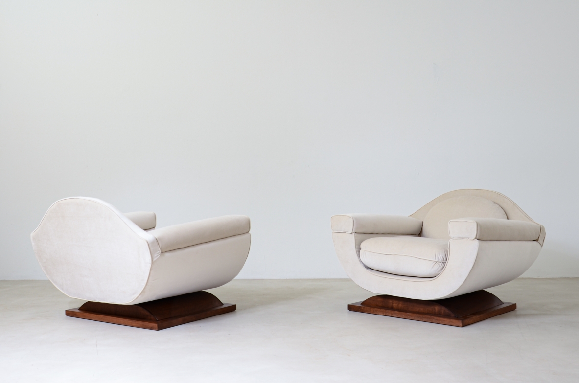 Pair of large organically shaped armchairs with wooden base, covered in cotton velvet.  Italian manufacture from the 1960s