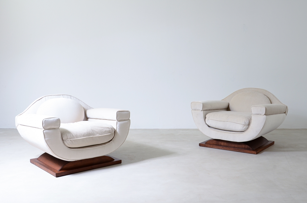 Pair of large organically shaped armchairs with wooden base, covered in cotton velvet.  Italian manufacture from the 1960s