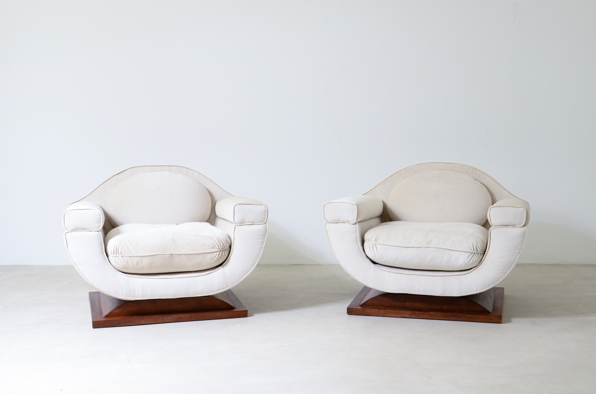 Pair of large organically shaped armchairs with wooden base, covered in cotton velvet.  Italian manufacture from the 1960s