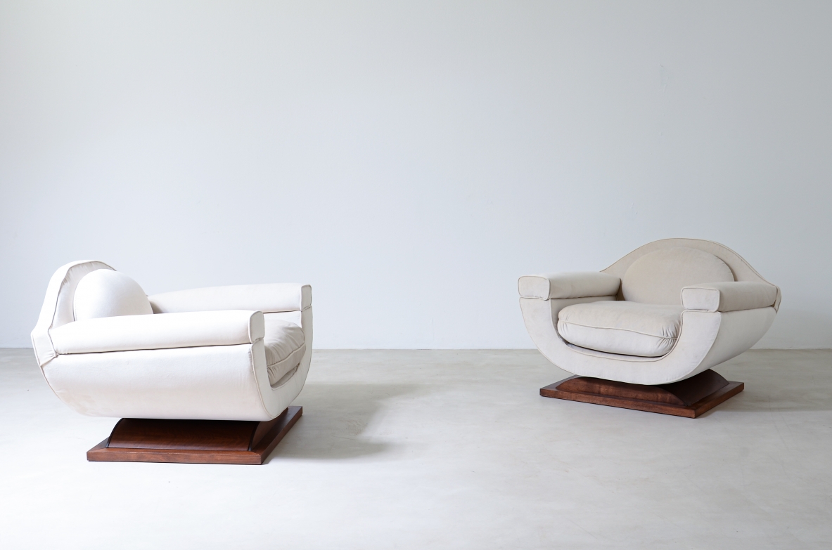 Pair of large organically shaped armchairs with wooden base, covered in cotton velvet.  Italian manufacture from the 1960s