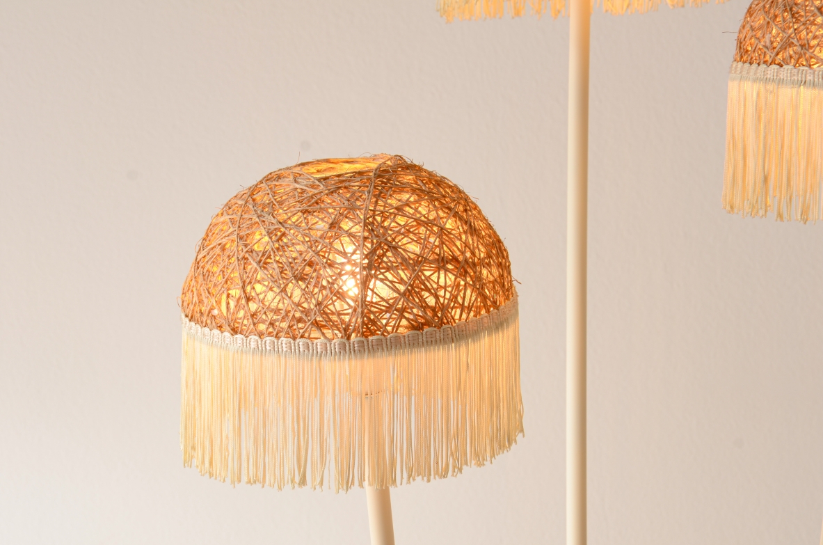 Three-arm floor lamp in painted metal with rattan shades and fabric fringes, Italian manufacture 1950's