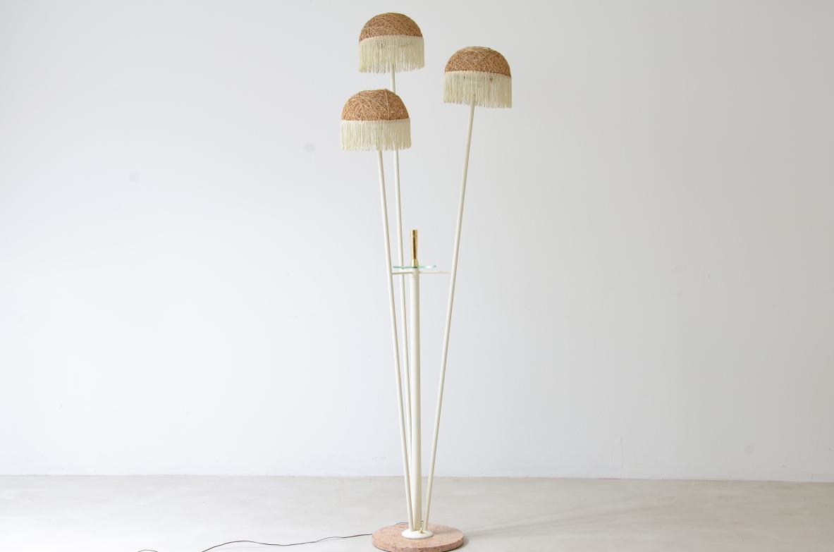 Three-arm floor lamp in painted metal with rattan shades and fabric fringes, Italian manufacture 1950's