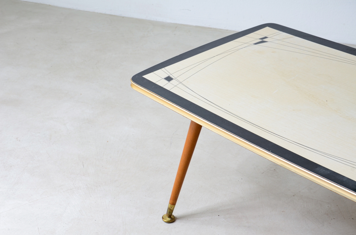 Coffee table with decorated methacrylate top and four legs with brass ends.  France 1960s.