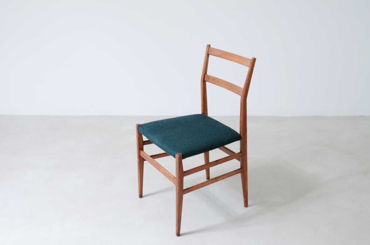 Gio Ponti  Set of 6 chairs in nut wood with fabric covering.  Model leggera