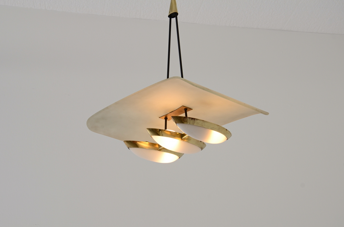 Gilardi Barzaghi metal and brass chandelier with curved metal shade. Manufacture 1950.