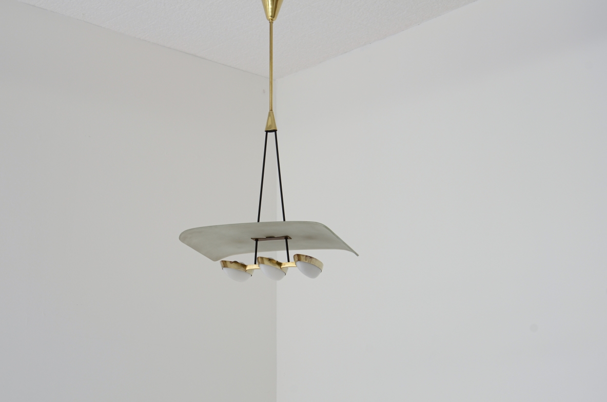 Gilardi Barzaghi metal and brass chandelier with curved metal shade. Manufacture 1950.