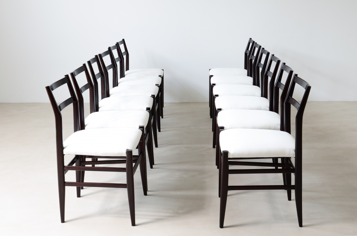 Gio Ponti  Set of 12 chairs in black stained wood with fabric covering.  Modello leggera,  Cassina manufacture 1954.