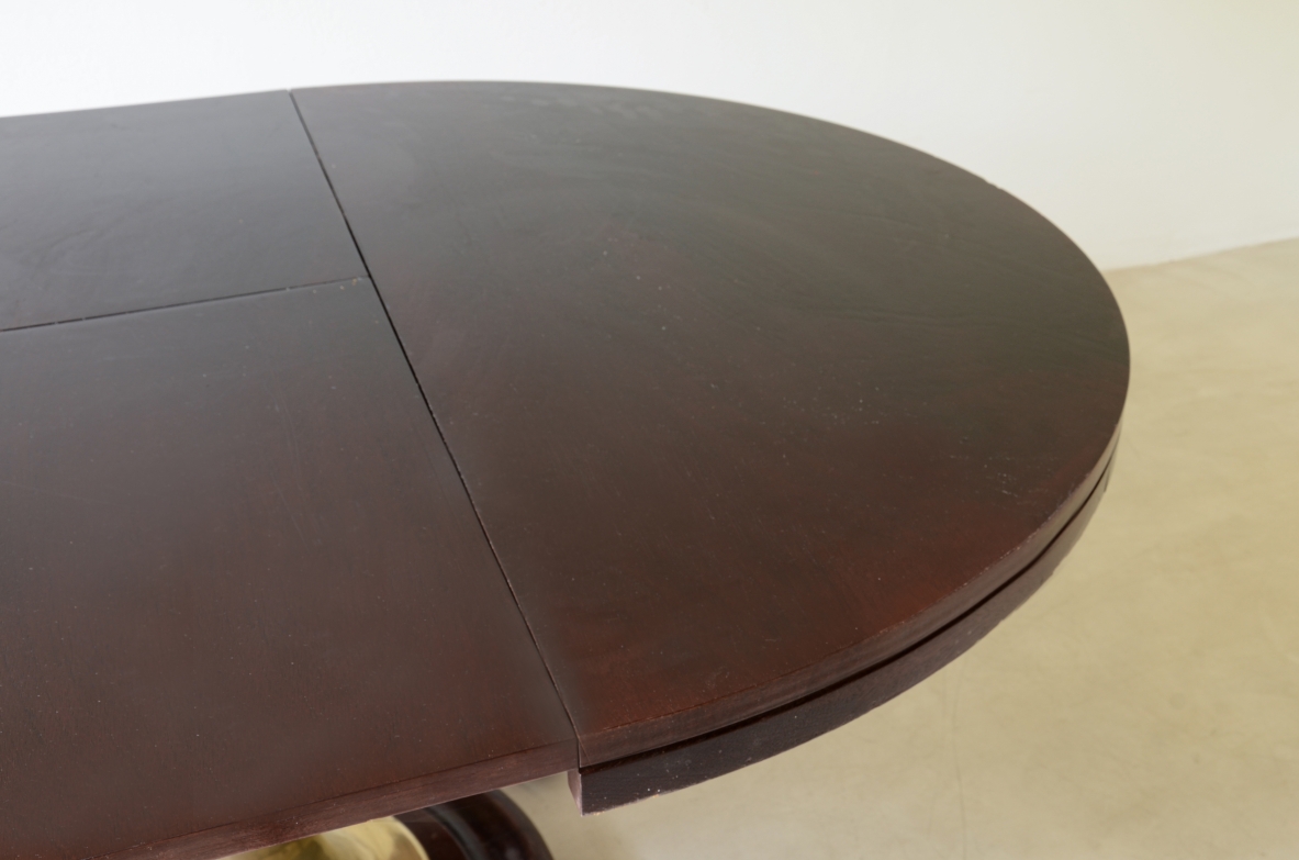 Extendable ship's table with cast bronze column, mahogany base and top. 1960's