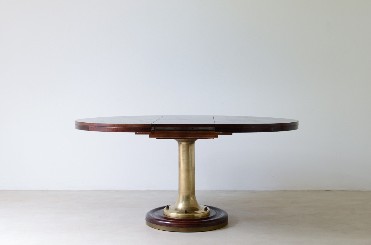 Extendable ship's table with cast bronze column, mahogany base and top. 1960's