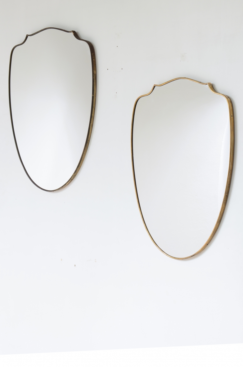 Pair of shaped brass mirrors.  Italian manufacture ca. 1950.