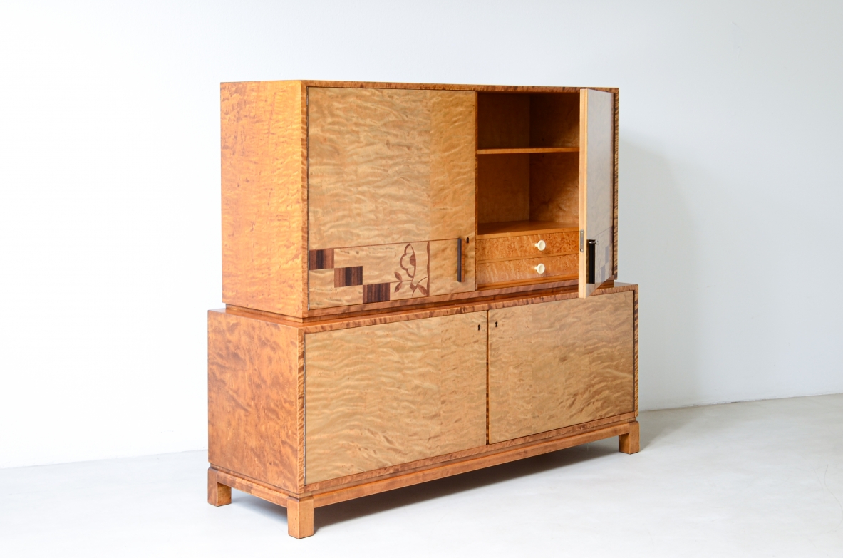 Storage unit in the style of Axel Einar Hjort, in flamed maple with Art Deco inlays on the front.  Sweden  approx. 1930